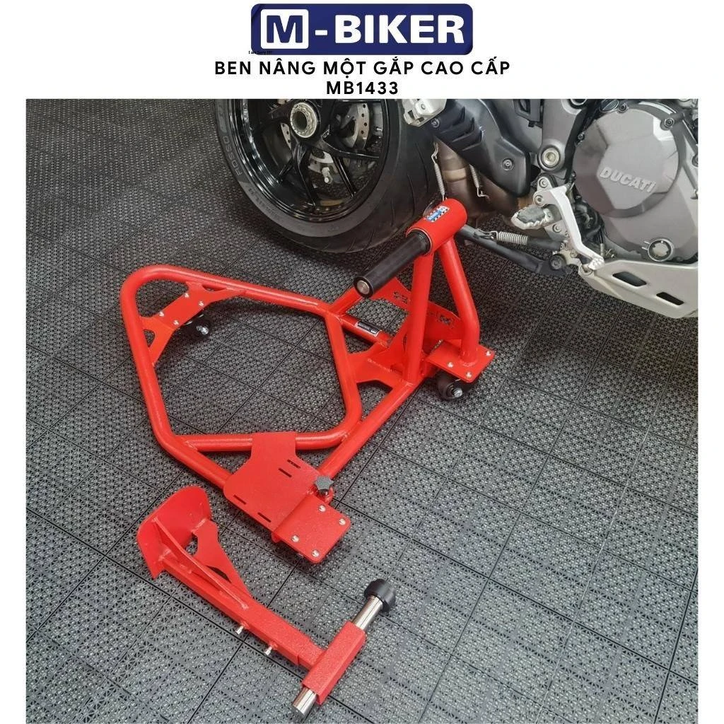 Ben nâng kẹp gắp sau universal M-Biker: đối chiếu tải trọng và quy tắc chọn mã 5 Trục chốt kim loại gia công CNC chính xác của ben nâng kẹp gắp sau M-Biker cắm vào lỗ trục rỗng mâm xe